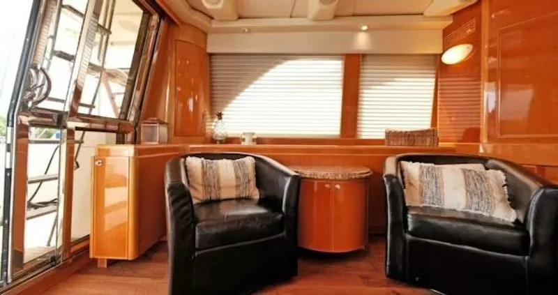 Slide: The Image of Luxurious 2004 McKinna Pilothouse interior with leather chairs and wooden accents. - 22