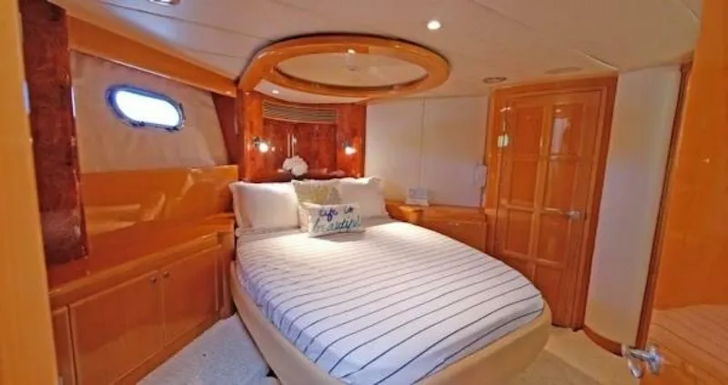 Slide: The Image of Luxurious 2004 McKinna Pilothouse bedroom with elegant wood finishes and cozy bedding. - 29