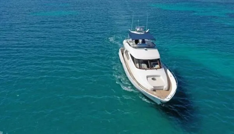Slide: The Image of 2004 McKinna Pilothouse yacht cruising on clear blue ocean waters. - 3
