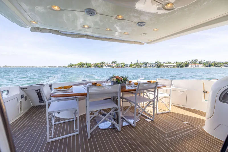 Slide: The Image of Luxury dining area on 2005 Azimut 68 yacht with ocean view. - 14
