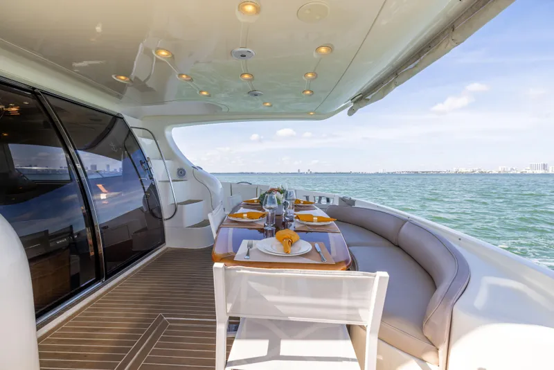 Slide: The Image of Luxurious dining area on a 2005 Azimut 68 yacht with ocean view. - 15