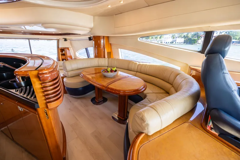 Slide: The Image of Luxurious interior of 2005 Azimut 68 yacht with elegant seating and wooden table. - 21