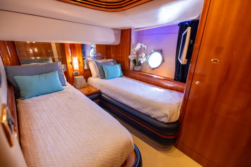 Slide: The Image of Luxurious twin cabin interior of 2005 Azimut 68 yacht with elegant wood finish. - 28