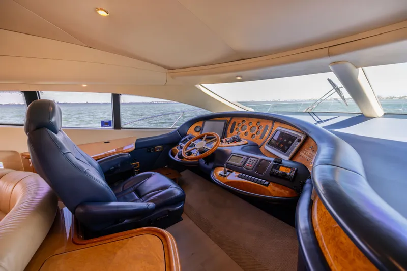 Slide: The Image of Luxurious 2005 Azimut 68 yacht cockpit with leather seating and advanced navigation controls. - 30