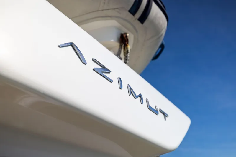 Slide: The Image of Azimut 68 yacht, 2005 model, close-up of logo against clear blue sky. - 7