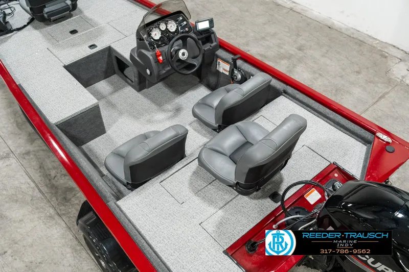 Slide: The Image of 2023 Tracker Pro 170 boat interior with gray seats and steering console. - 10