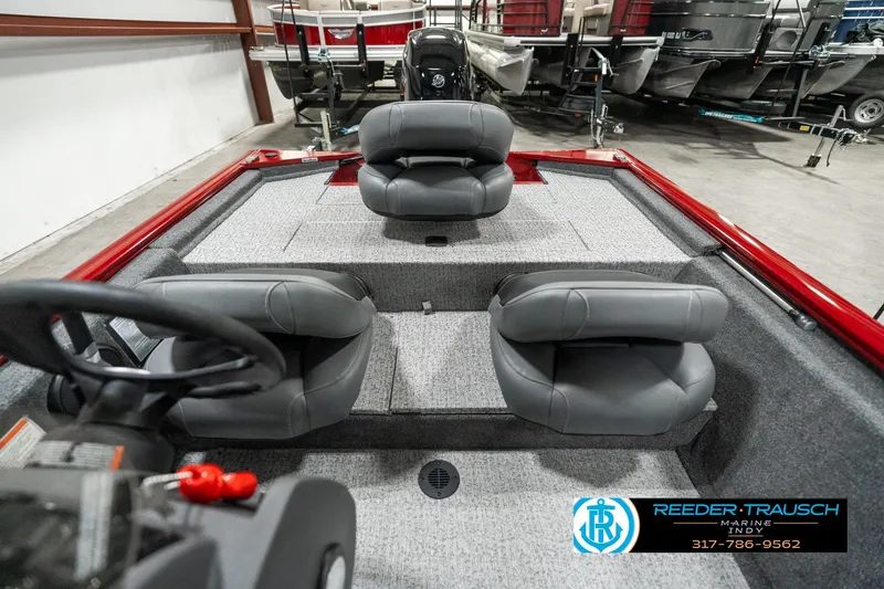 Slide: The Image of 2023 Tracker Pro 170 boat interior with gray seating and steering wheel. - 14