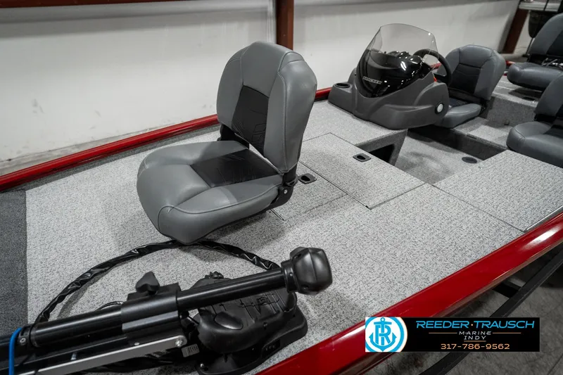Slide: The Image of 2023 Tracker Pro 170 boat interior with gray seating and steering console. - 15