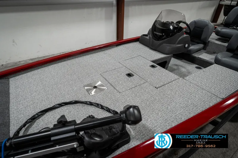 Slide: The Image of 2023 Tracker Pro 170 boat interior with steering console and seating. - 16