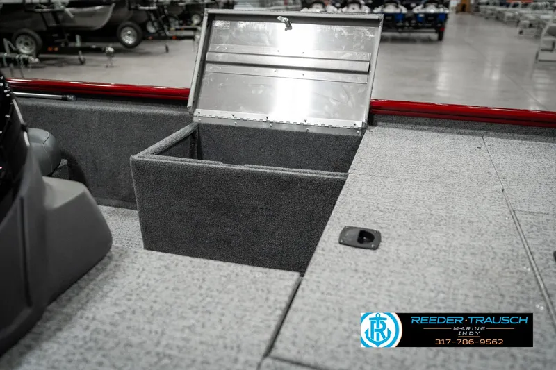 Slide: The Image of 2023 Tracker Pro 170 boat storage compartment open in showroom. - 19