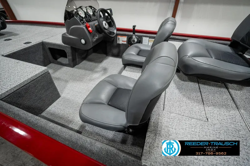 Slide: The Image of 2023 Tracker Pro 170 boat interior with gray seating and steering console. - 20
