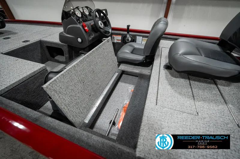 Slide: The Image of 2023 Tracker Pro 170 boat interior with open storage compartment and seating. - 21