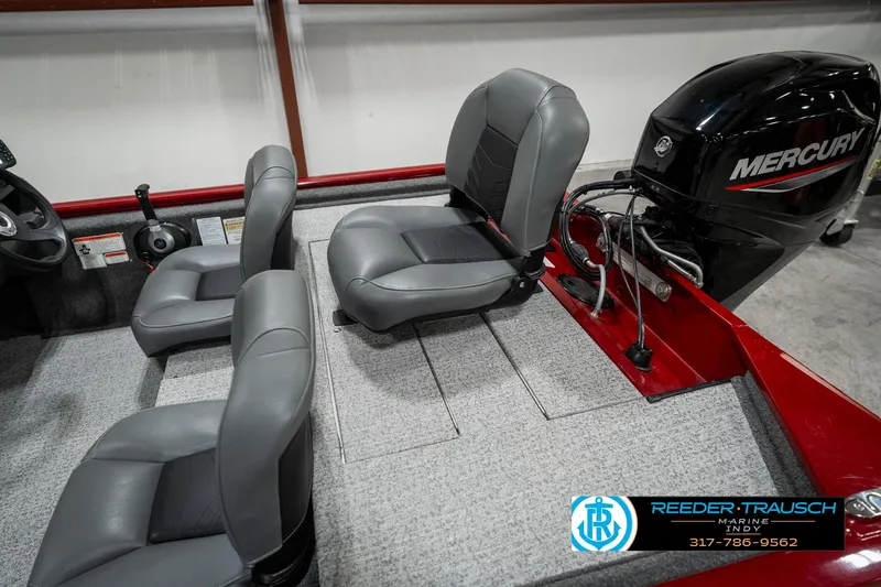 Slide: The Image of 2023 Tracker Pro 170 boat interior with Mercury engine and gray seating. - 22