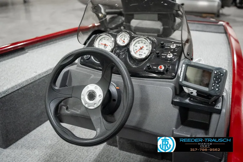 Slide: The Image of 2023 Tracker Pro 170 boat dashboard with steering wheel and gauges. - 25