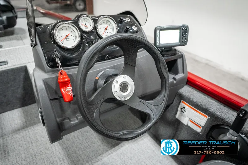 Slide: The Image of 2023 Tracker Pro 170 boat dashboard with steering wheel and gauges. - 26