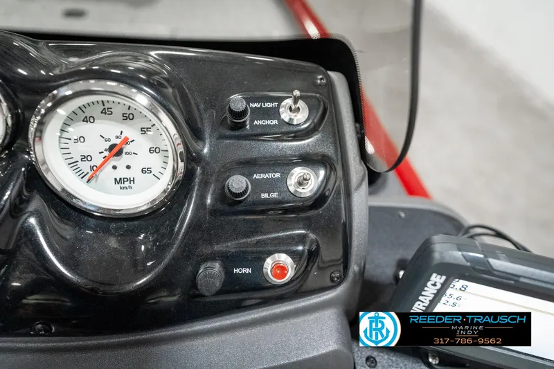 Slide: The Image of Dashboard of 2023 Tracker Pro 170 boat with speedometer and control switches. - 29