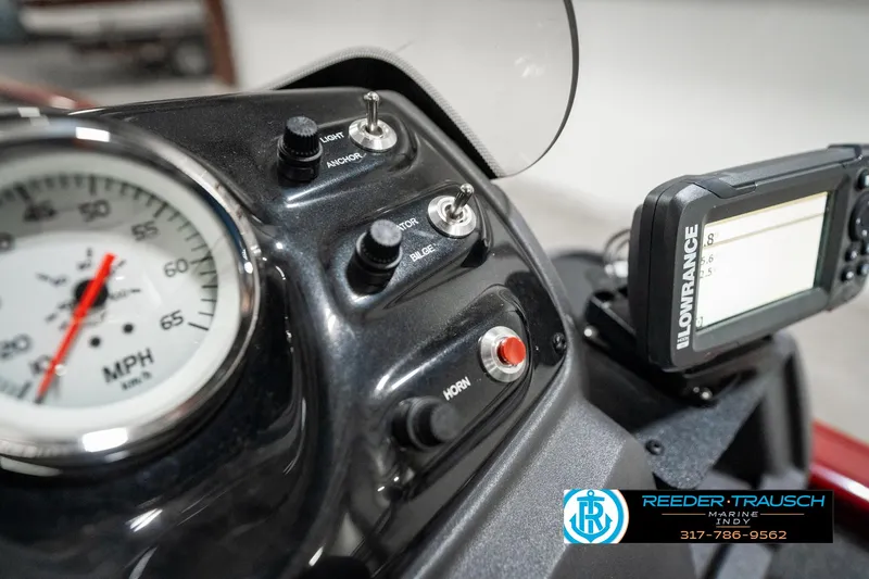 Slide: The Image of 2023 Tracker Pro 170 dashboard with speedometer and Lowrance GPS device. - 31