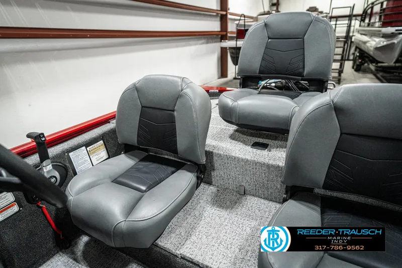 Slide: The Image of 2023 Tracker Pro 170 boat interior with gray seating and carpeted flooring. - 33