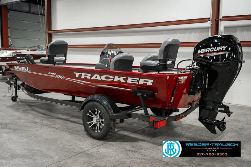 Slide: The Image of 2023 Tracker Pro 170 boat with Mercury engine in showroom. - 4
