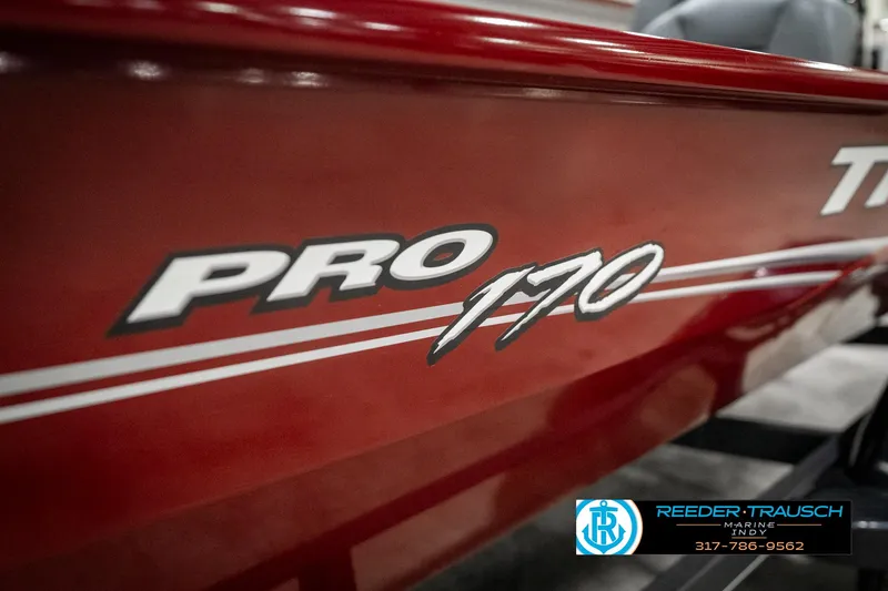 Slide: The Image of Red 2023 Tracker Pro 170 boat with logo and dealership contact information. - 41