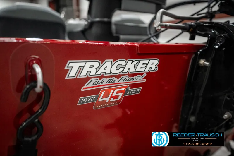 Slide: The Image of 2023 Tracker Pro 170 boat, red with anniversary logo, "Fish the Finest." - 43
