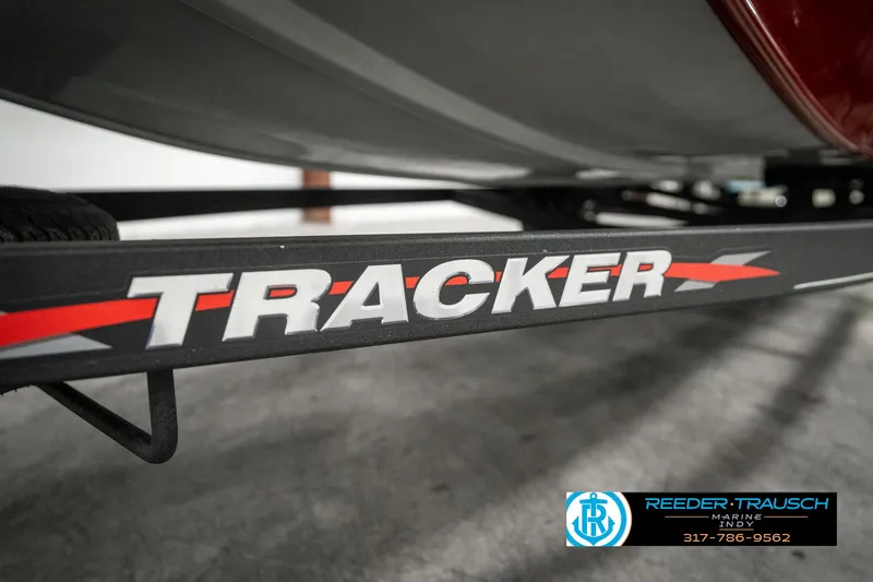 Slide: The Image of 2023 Tracker Pro 170 boat trailer with logo and dealership contact information. - 47