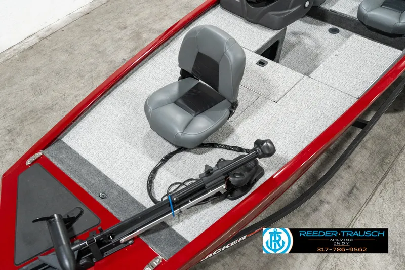 Slide: The Image of 2023 Tracker Pro 170 boat interior with gray seating and red accents. - 7