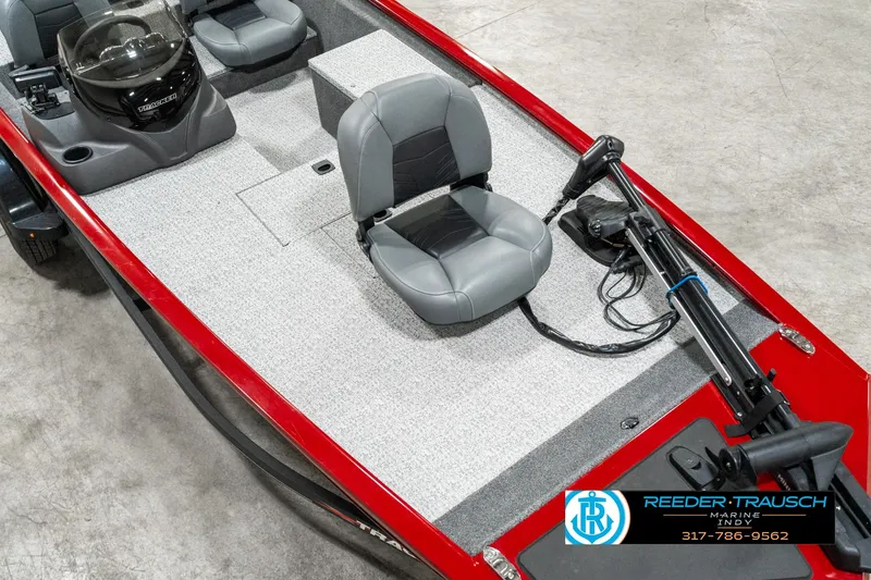 Slide: The Image of 2023 Tracker Pro 170 boat interior with gray seating and red trim. - 8