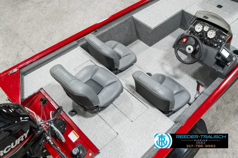 Slide: The Image of 2023 Tracker Pro 170 boat interior with gray seats and steering console. - 9