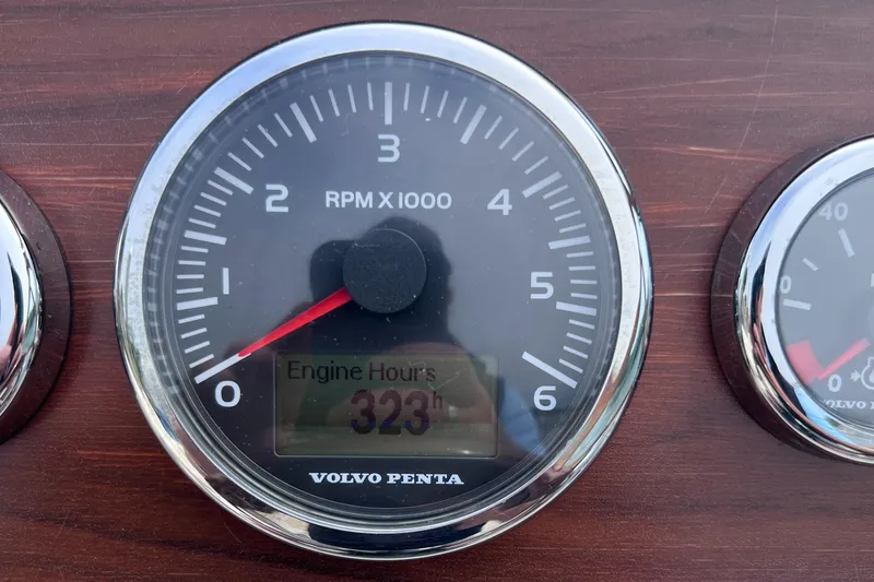 Slide: The Image of Volvo Penta tachometer showing 323 engine hours on Hunt Yachts Harrier 25, 2011 model. - 12