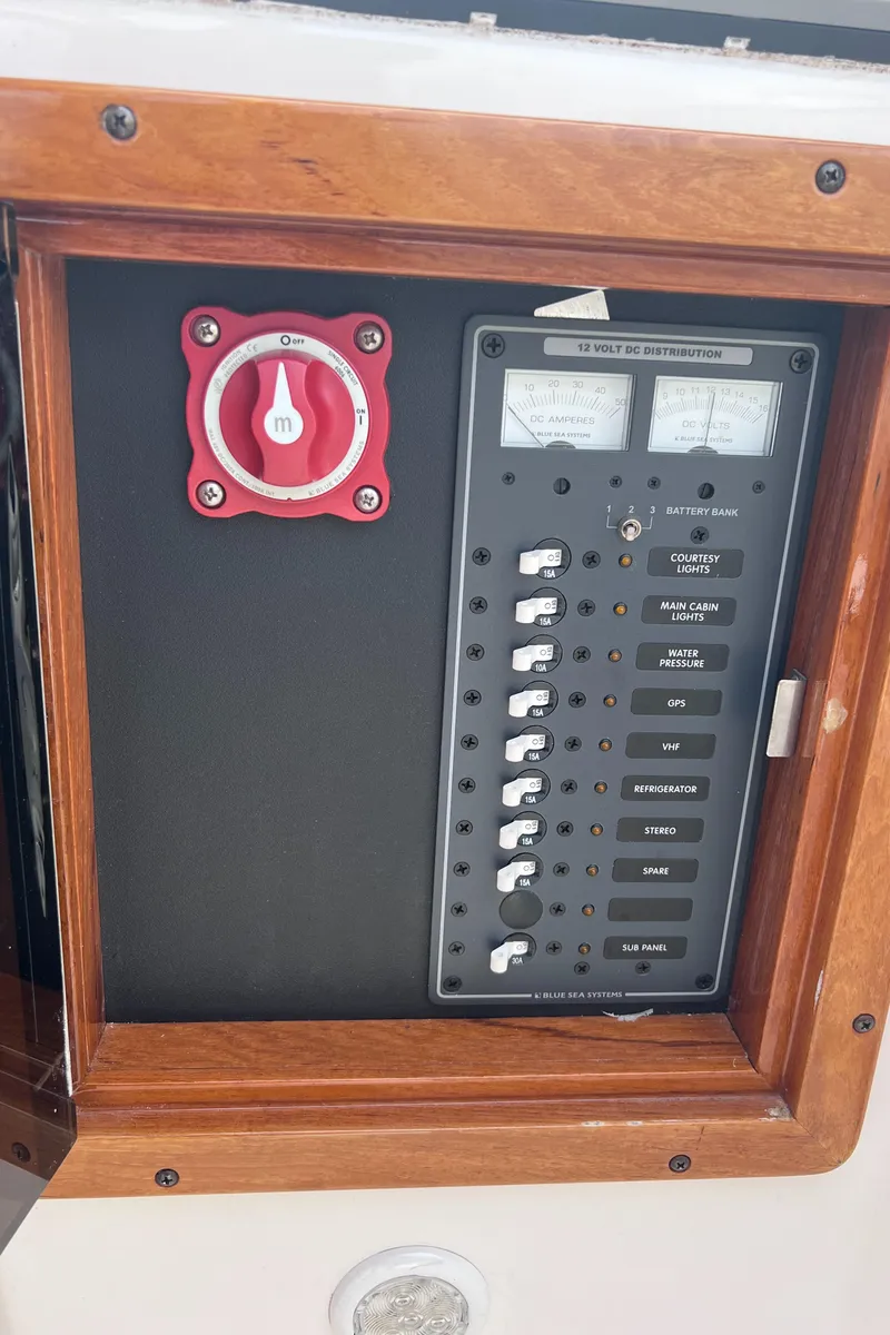 Slide: The Image of Control panel of 2011 Hunt Yachts Harrier 25 with switches and gauges. - 17