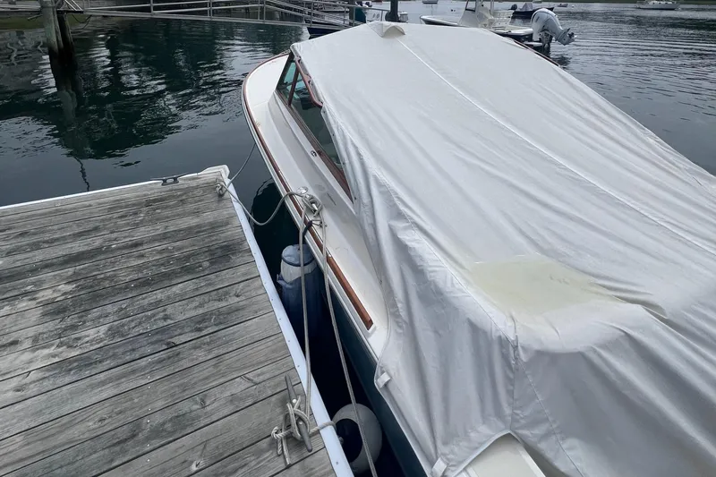 Slide: The Image of 2011 Hunt Yachts Harrier 25 covered at dockside. - 3