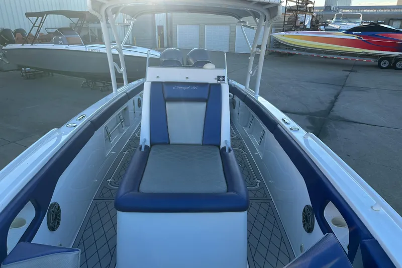 Slide: The Image of Concept 36 boat interior, 2014 model, featuring blue and white seating. - 11