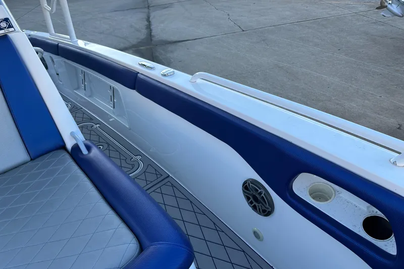 Slide: The Image of 2014 Concept 36 boat interior with blue and white seating and deck details. - 13