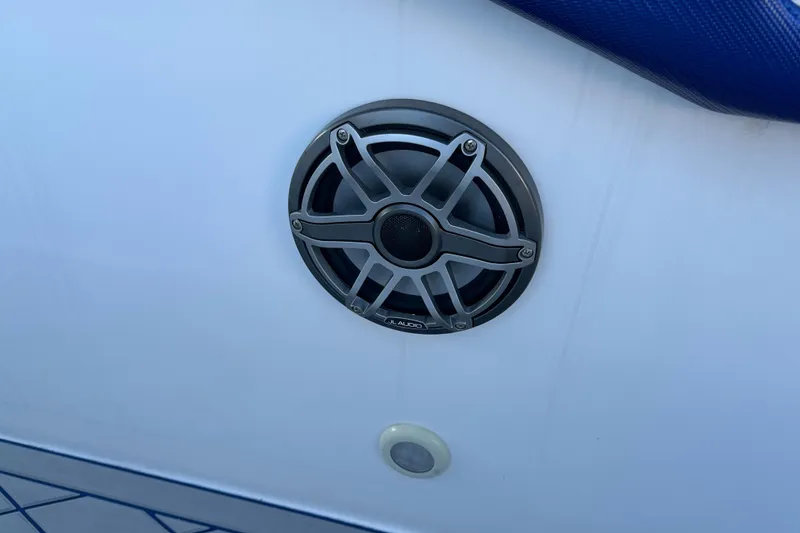 Slide: The Image of Boat speaker on a 2014 Concept 36 model, mounted on a white surface. - 14