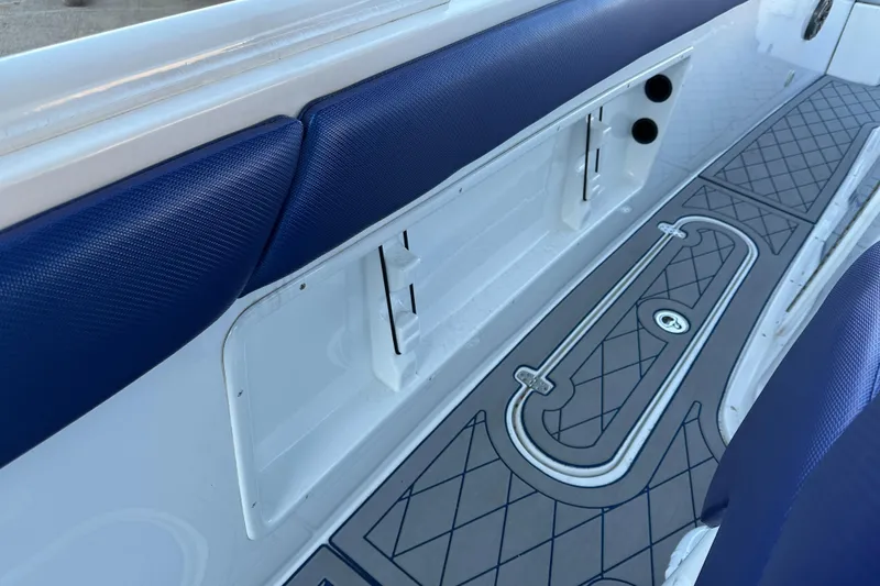 Slide: The Image of Interior of 2014 Concept 36 boat with blue seating and patterned flooring. - 16