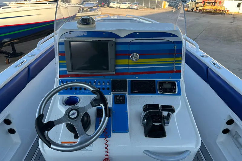 Slide: The Image of Concept 36 boat dashboard, 2014 model, featuring steering wheel and navigation controls. - 17