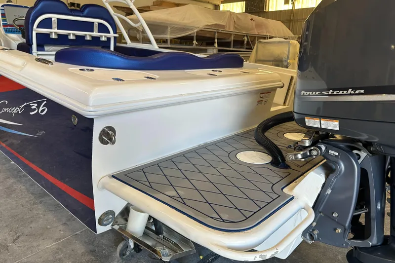 Slide: The Image of Concept 36 boat, 2014 model, featuring a four-stroke engine and spacious deck area. - 21