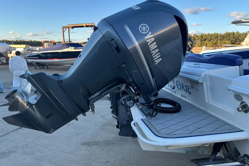Slide: The Image of Yamaha outboard motor on 2014 Concept 36 boat, docked outdoors. - 3