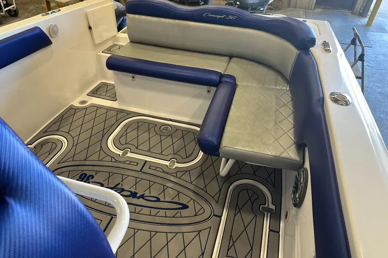 Slide: The Image of 2014 Concept 36 boat interior with blue and gray seating and custom flooring. - 31