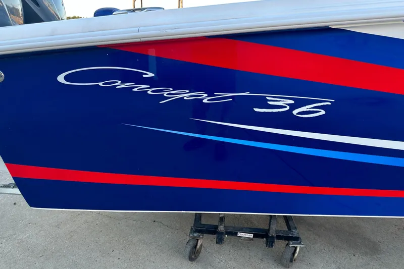 Slide: The Image of Blue and red Concept 36 boat, 2014 model, on a stand. - 4