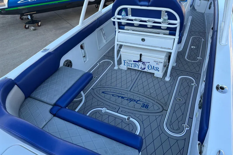 Slide: The Image of Concept 36 boat interior, 2014 model, featuring blue seating and custom flooring design. - 5