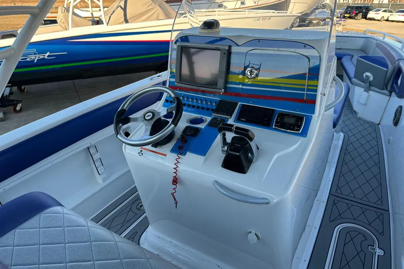 Slide: The Image of Concept 36 boat cockpit, 2014 model, featuring steering wheel and navigation controls. - 7