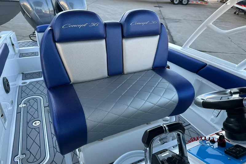 Slide: The Image of 2014 Concept 36 boat seat with blue and gray upholstery, diamond pattern design. - 8