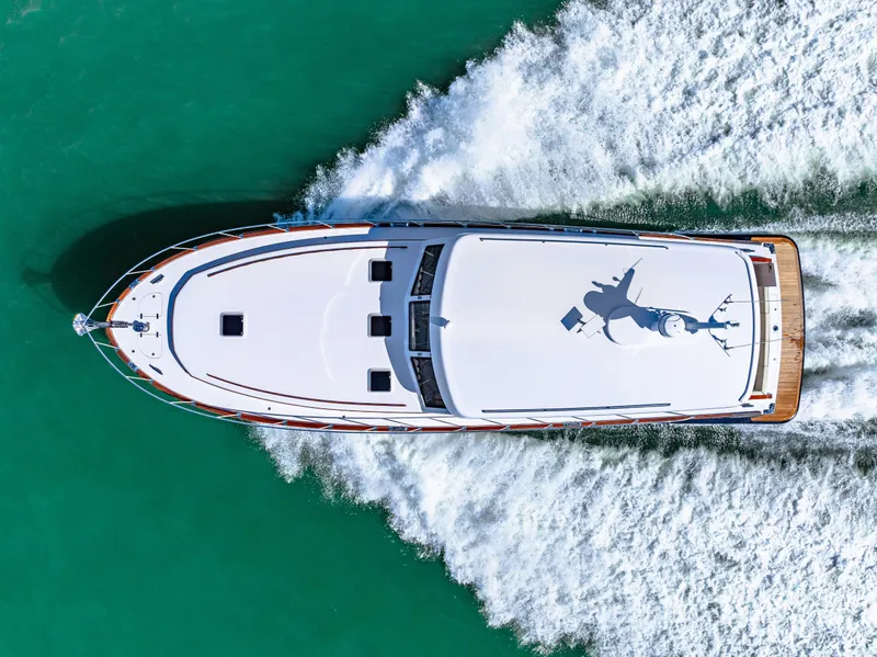 Slide: The Image of Aerial view of 2024 Vicem 62 Classic yacht cruising on turquoise water. - 28