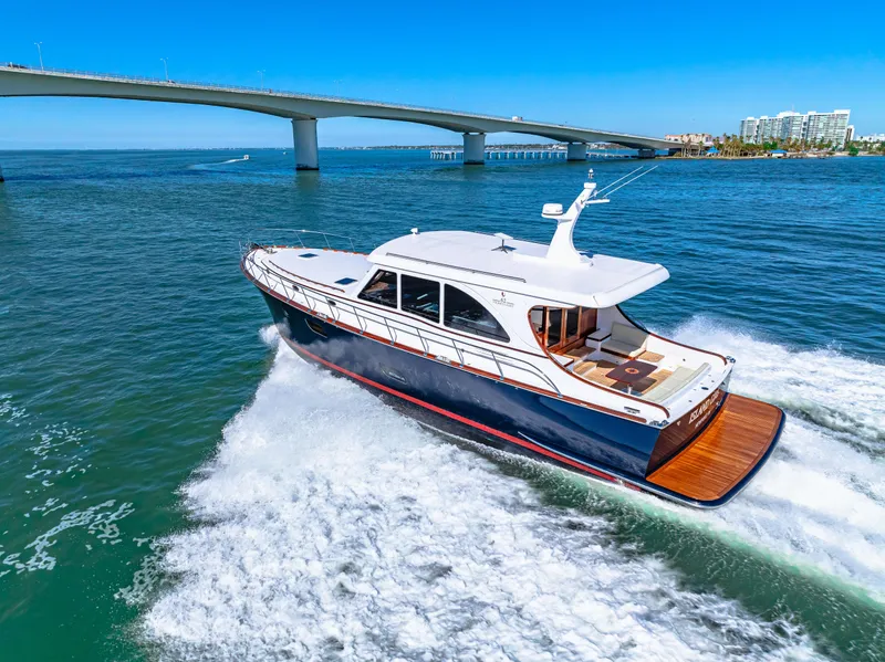 Slide: The Image of 2024 Vicem 62 Classic yacht cruising under a bridge on a sunny day. - 31