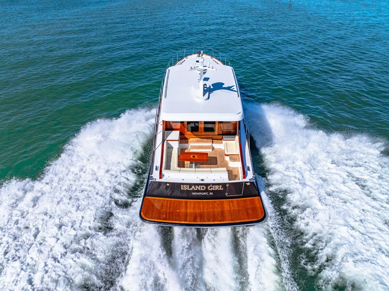Slide: The Image of 2024 Vicem 62 Classic yacht cruising on open water, rear view. - 33
