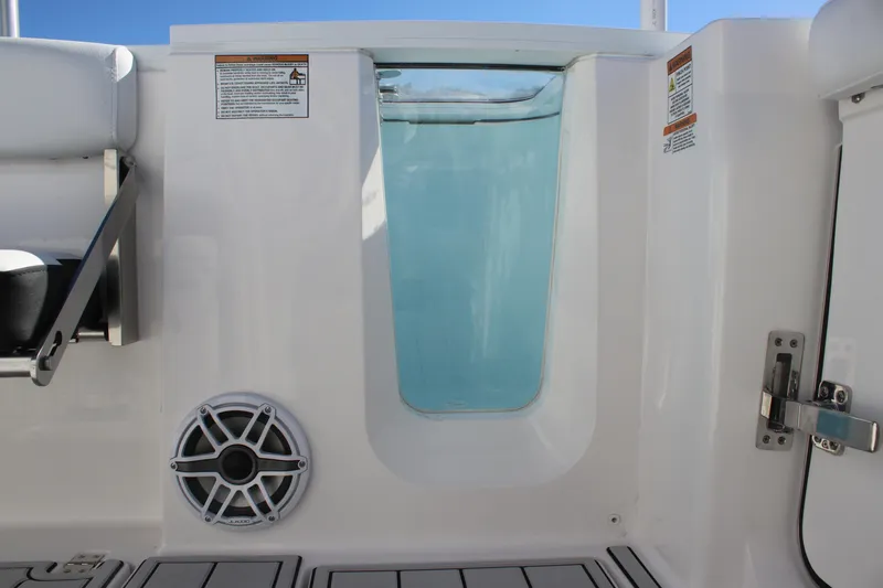 Slide: The Image of Sea Fox 288 Commander 2025 boat interior with speaker and water view. - 14