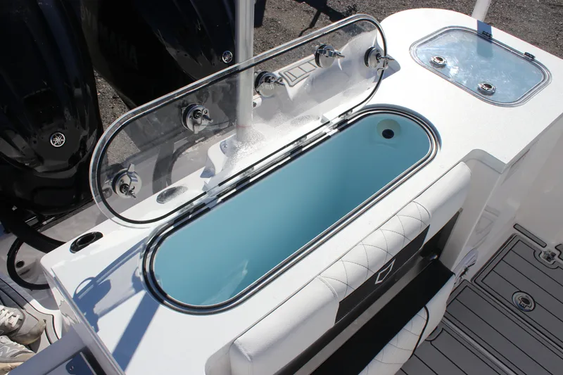 Slide: The Image of 2025 Sea Fox 288 Commander boat with open livewell and seating area. - 16