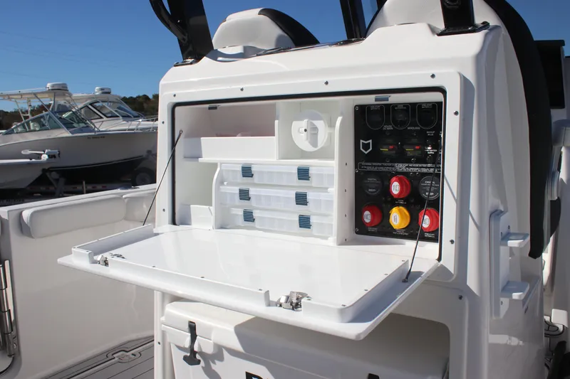 Slide: The Image of 2025 Sea Fox 288 Commander boat console with storage compartments and control panel. - 21